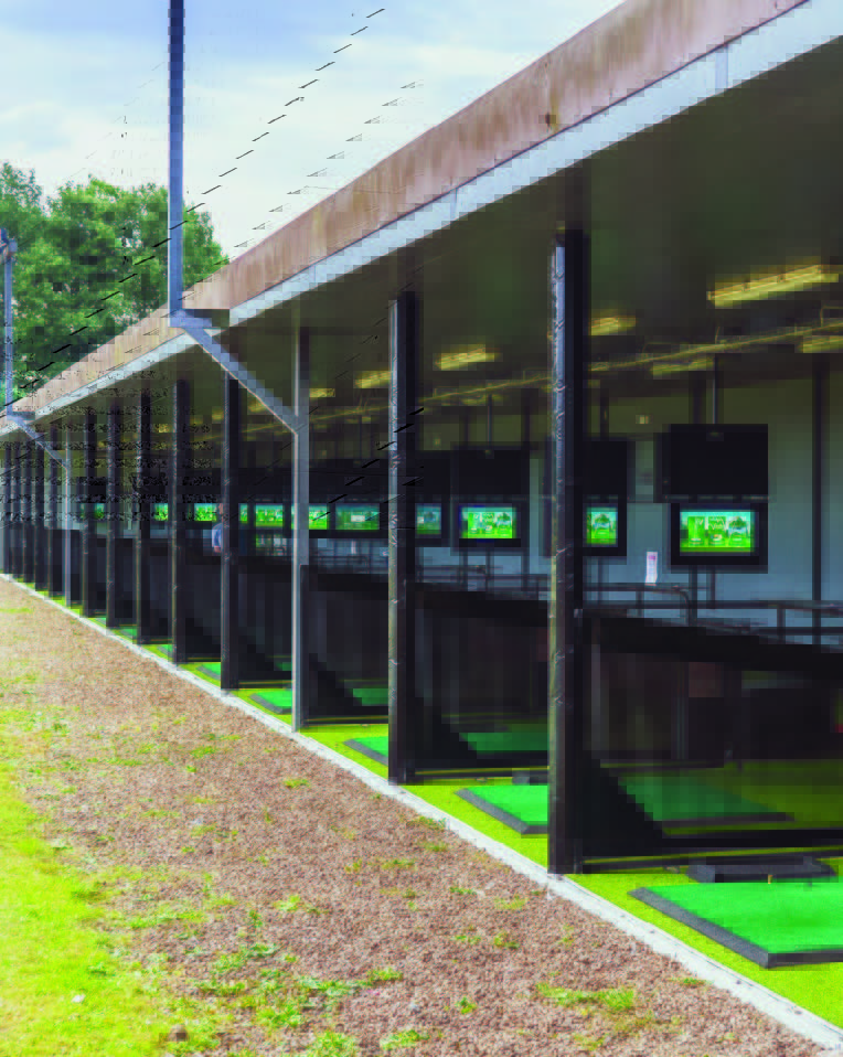 Trackman Range bay area with touch screens on outdoor driving range.