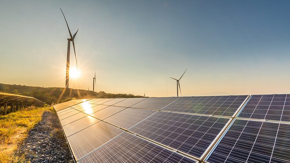 picture of windmills and solar panels to represent renewable energy