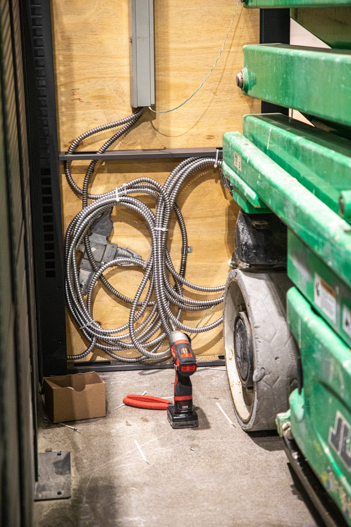 Wiring tied up before placing wall over to install self-checkout.